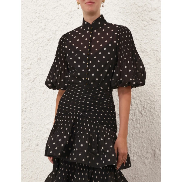 Elevate your elegance in this Zimmermann Tops available now at Coveti