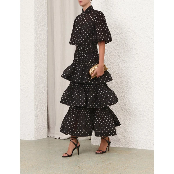 Elevate your elegance in this Zimmermann Tops available now at Coveti