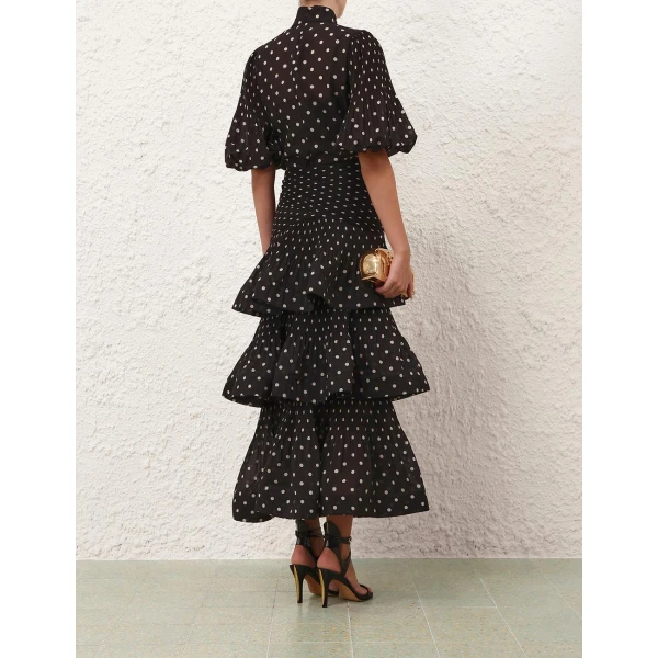 Elevate your elegance in this Zimmermann Tops available now at Coveti