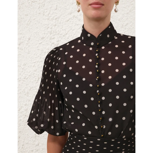 Elevate your elegance in this Zimmermann Tops available now at Coveti