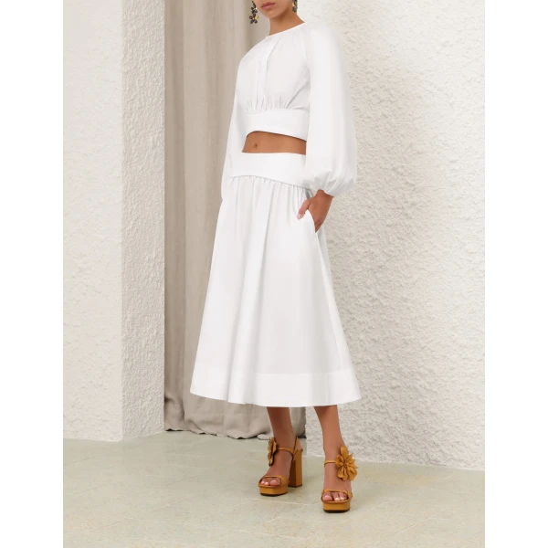 Elevate your elegance in this Zimmermann Tops available now at Coveti