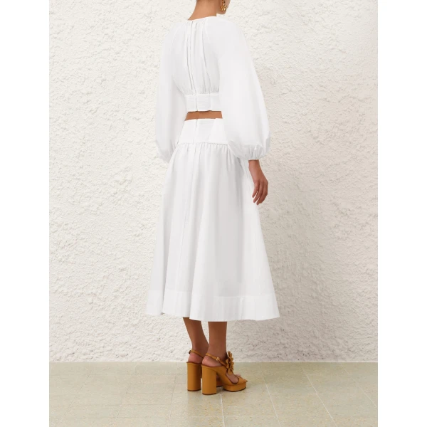 Elevate your elegance in this Zimmermann Tops available now at Coveti