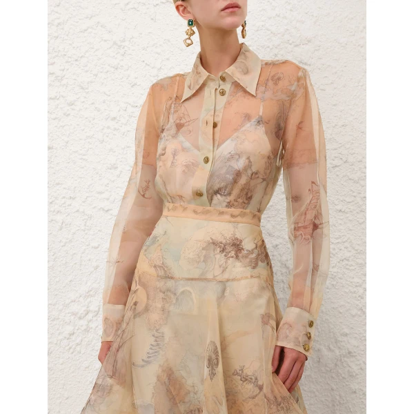 Elevate your elegance in this Zimmermann Tops available now at Coveti