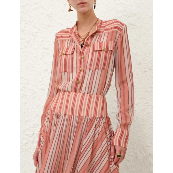 Elevate your elegance in this Zimmermann Tops available now at Coveti