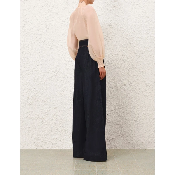 Elevate your elegance in this Zimmermann Tops available now at Coveti