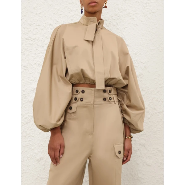Elevate your elegance in this Zimmermann Tops available now at Coveti