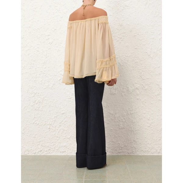 Elevate your elegance in this Zimmermann Tops available now at Coveti