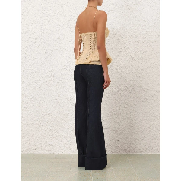 Elevate your elegance in this Zimmermann Tops available now at Coveti