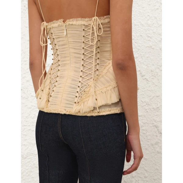 Elevate your elegance in this Zimmermann Tops available now at Coveti