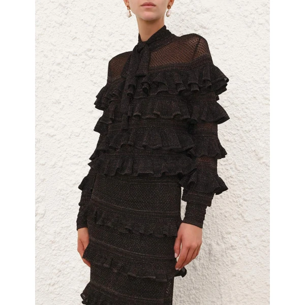 Elevate your elegance in this Zimmermann Tops available now at Coveti