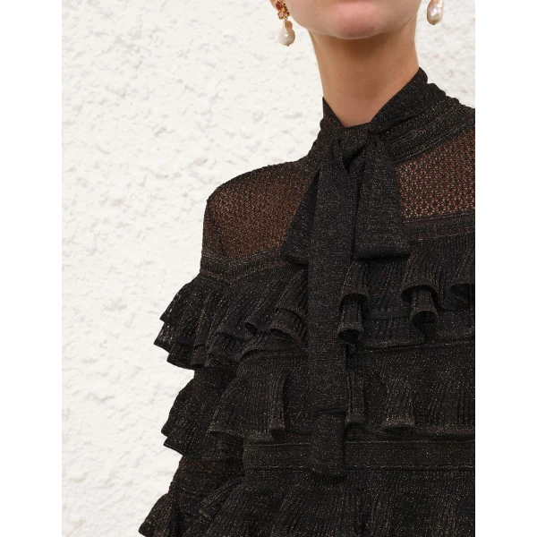 Elevate your elegance in this Zimmermann Tops available now at Coveti