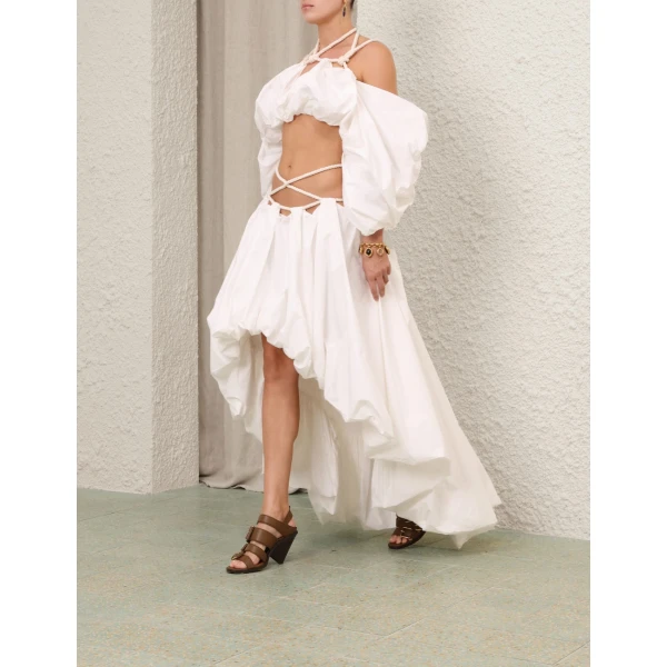 Elevate your elegance in this Zimmermann Tops available now at Coveti