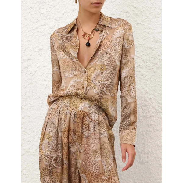 Elevate your elegance in this Zimmermann Tops available now at Coveti