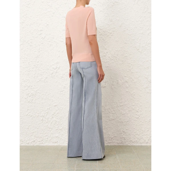 Elevate your elegance in this Zimmermann Tops available now at Coveti