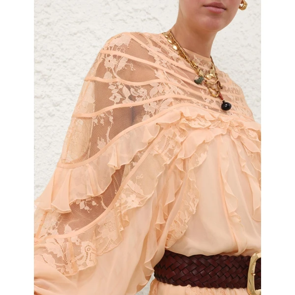 Elevate your elegance in this Zimmermann Tops available now at Coveti