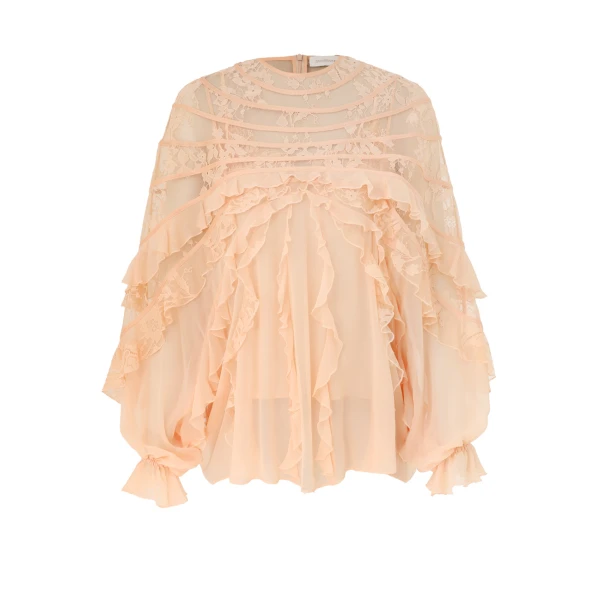 Elevate your elegance in this Zimmermann Tops available now at Coveti