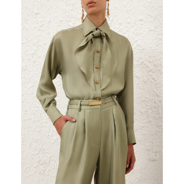 Elevate your elegance in this Zimmermann Tops available now at Coveti