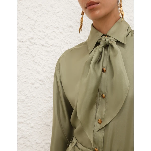 Elevate your elegance in this Zimmermann Tops available now at Coveti