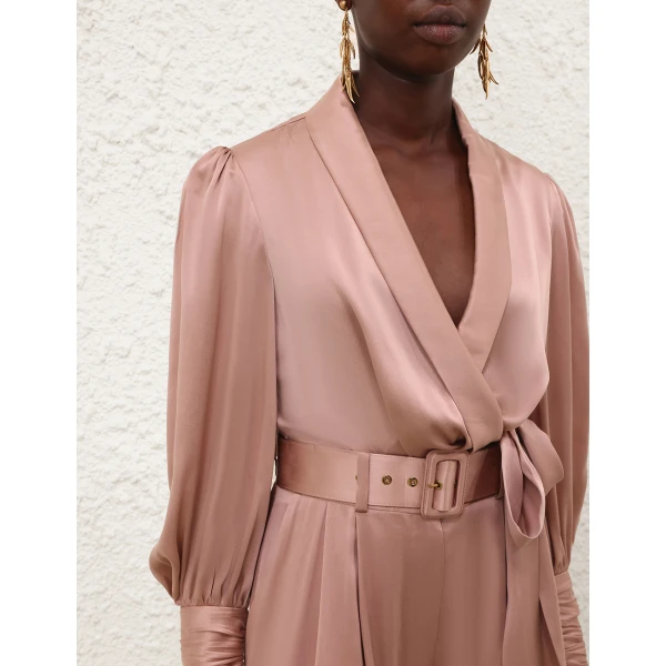 Elevate your elegance in this Zimmermann Tops available now at Coveti