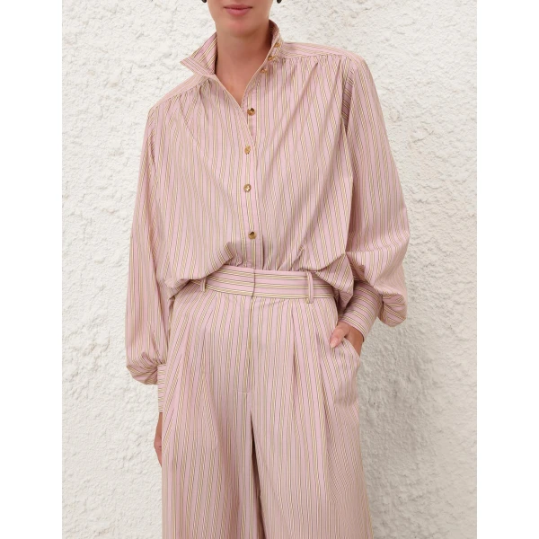 Elevate your elegance in this Zimmermann Tops available now at Coveti