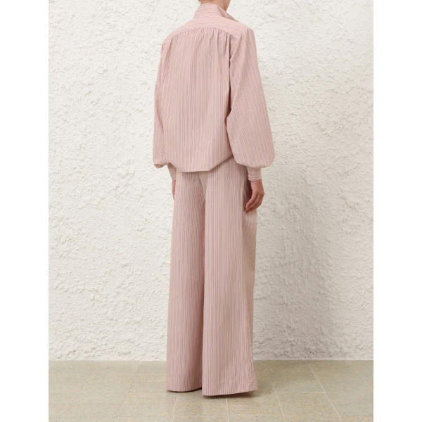 Elevate your elegance in this Zimmermann Tops available now at Coveti