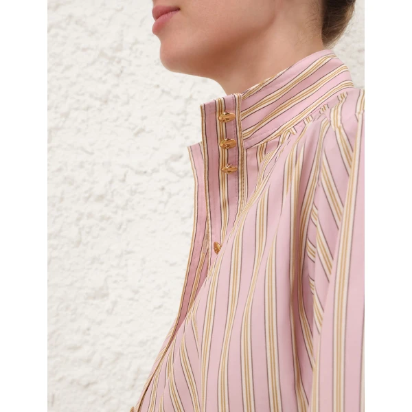 Elevate your elegance in this Zimmermann Tops available now at Coveti