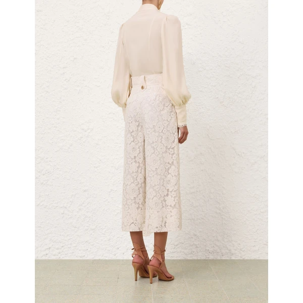 Elevate your elegance in this Zimmermann Tops available now at Coveti