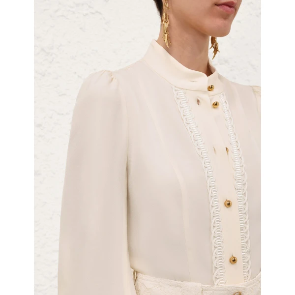 Elevate your elegance in this Zimmermann Tops available now at Coveti