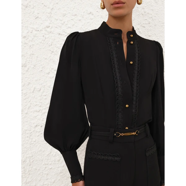 Elevate your elegance in this Zimmermann Tops available now at Coveti