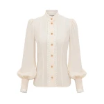 Elevate your elegance in this Zimmermann Tops available now at Coveti