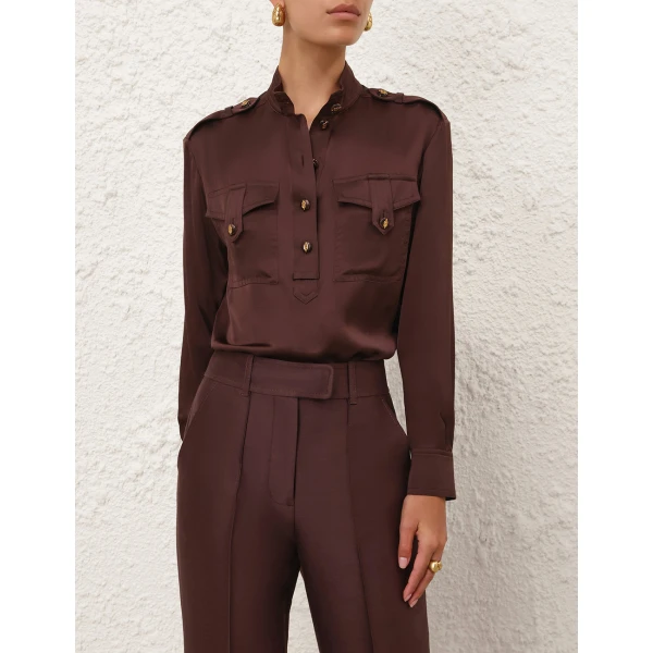 Elevate your elegance in this Zimmermann Tops available now at Coveti
