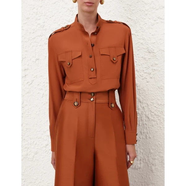 Elevate your elegance in this Zimmermann Tops available now at Coveti