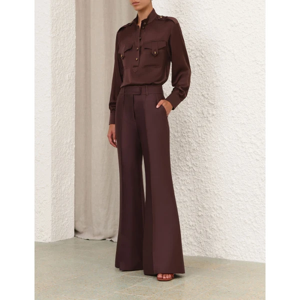 Elevate your elegance in this Zimmermann Tops available now at Coveti