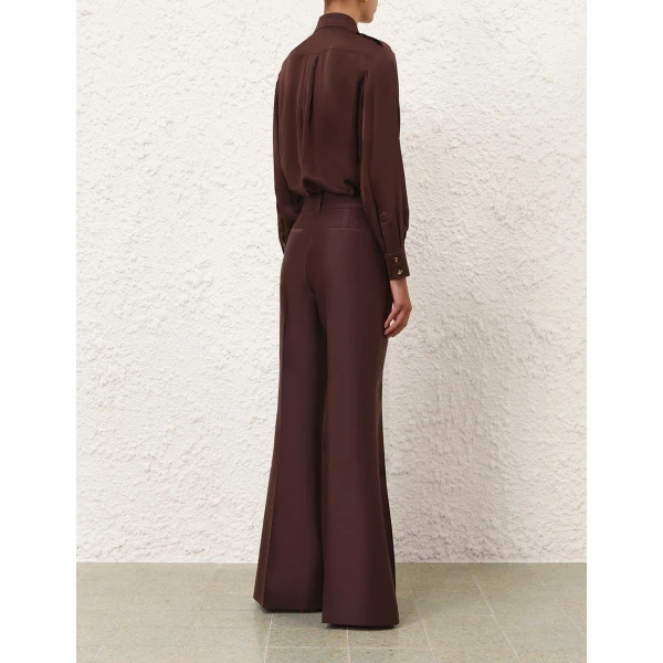 Elevate your elegance in this Zimmermann Tops available now at Coveti