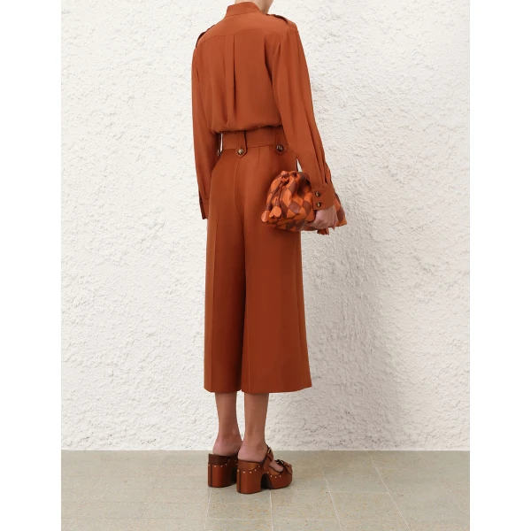Elevate your elegance in this Zimmermann Tops available now at Coveti