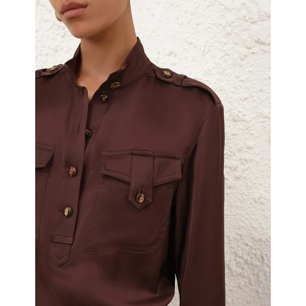 Elevate your elegance in this Zimmermann Tops available now at Coveti