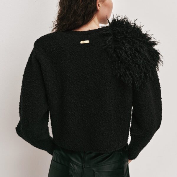 Aje Aus  – structured silhouette with raw femininity from Coveti