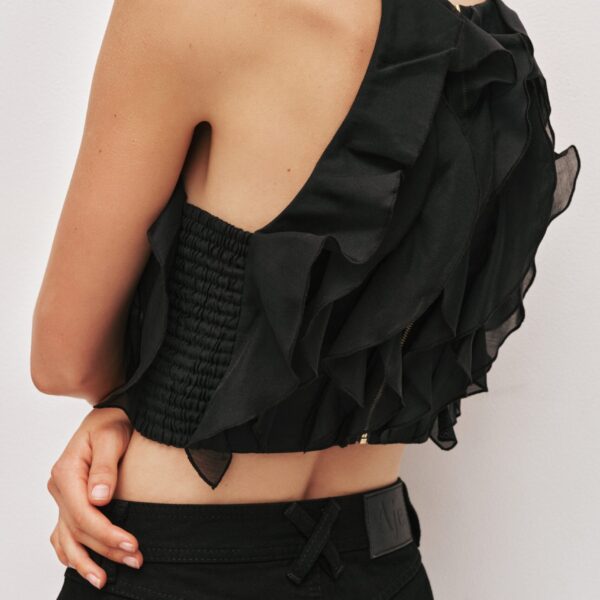 Aje Aus  – structured silhouette with raw femininity from Coveti