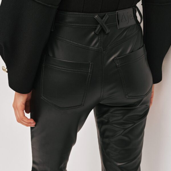 Aje Aus  – structured silhouette with raw femininity from Coveti