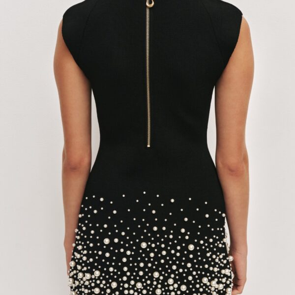 Aje Aus  – structured silhouette with raw femininity from Coveti