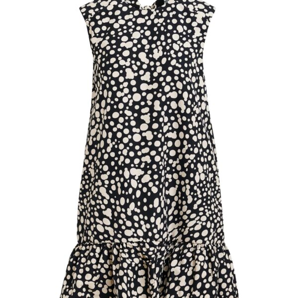 Black and white ruffled mini dress with open-back and bow detail