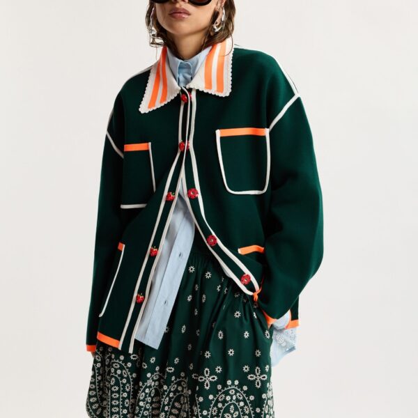white and orange fine knit cardigan with lace-trimmed collar and strawberry-shaped buttons