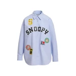 Light blue cotton shirt with multicolored Peanuts™ Snoopy patches