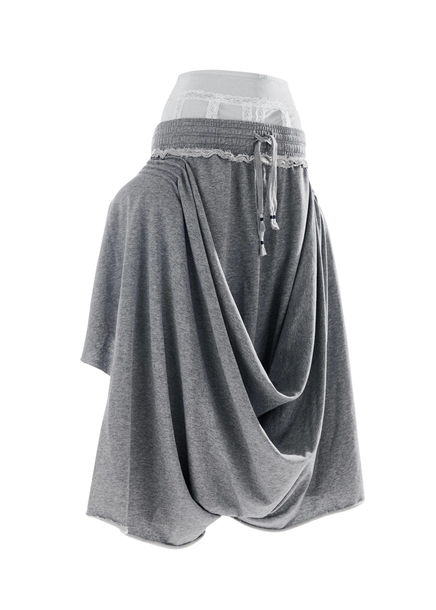 Light grey draped jersey pants with off-white lace undergarment