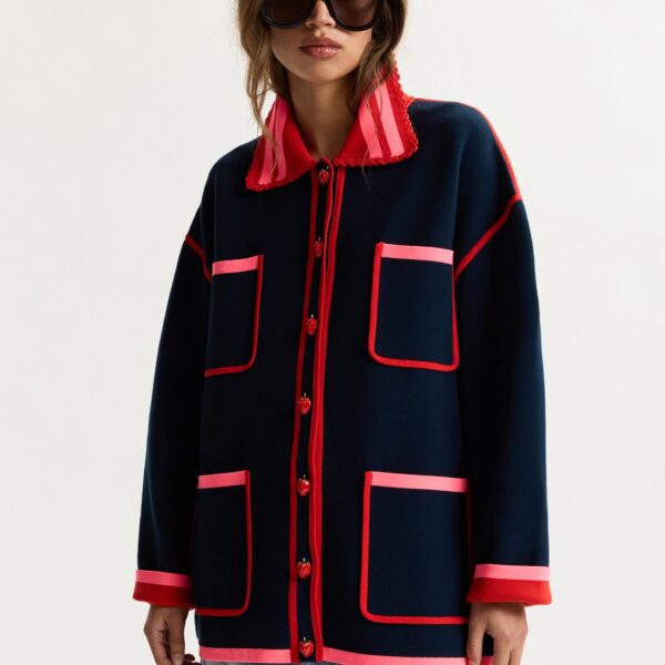 red and pink fine knit cardigan with lace-trimmed collar and strawberry-shaped buttons