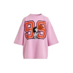 Pink T-shirt with appliquéd Peanuts™ Lucy patch and text print