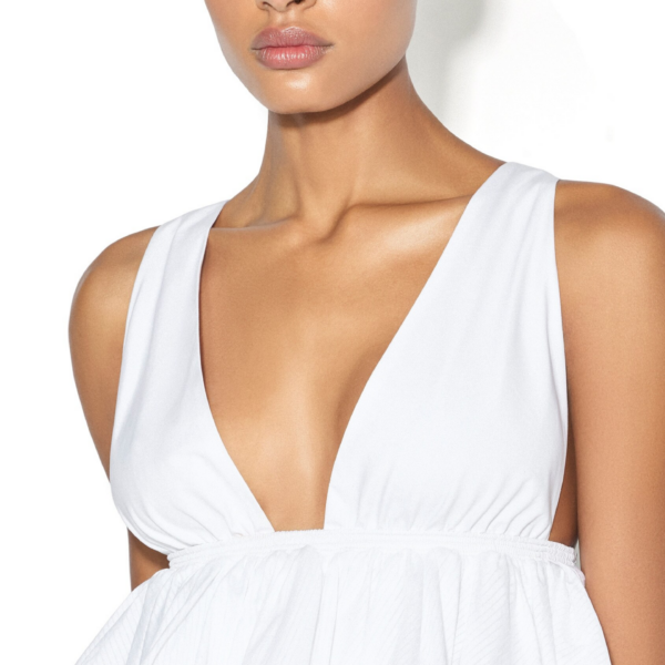 Alaïa Openwork Cotton Peplum Top - ALAÏA Tops - Laser Cut Luxury - Shop at Coveti