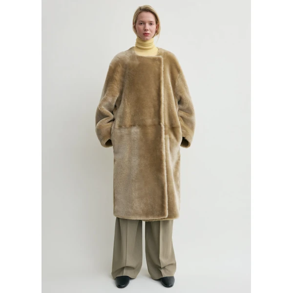 Totême Collarless shearling coat in Rye - Coats - Scandinavian Minimalist Luxury at Coveti