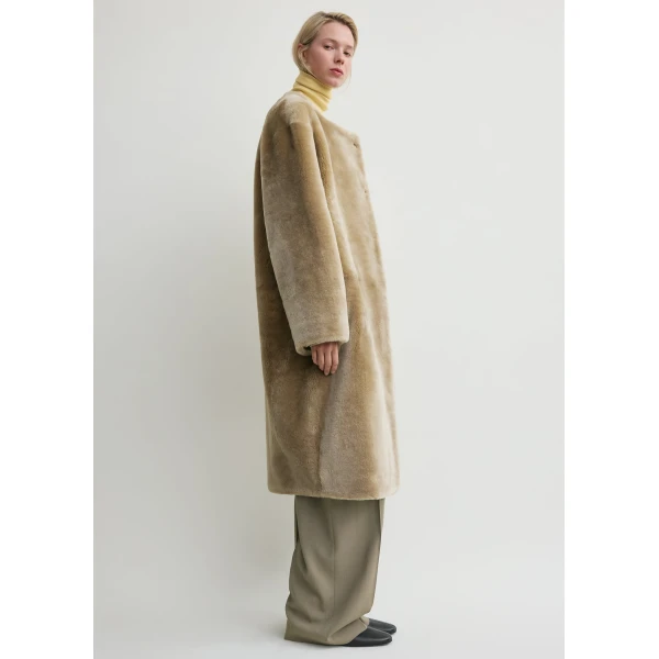 Totême Collarless shearling coat in Rye - Coats - Scandinavian Minimalist Luxury at Coveti