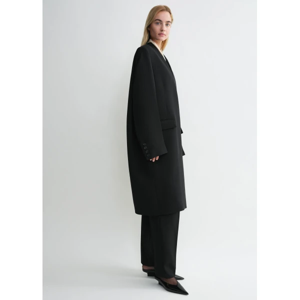 Totême Deep pleat coat in Black - Coats - Scandinavian Minimalist Luxury at Coveti